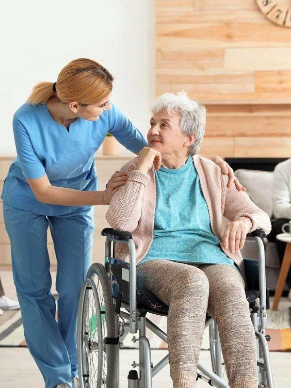 Caregiver holding hands with senior